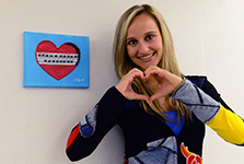 Photos of Caroline Alpert with one of her paintings