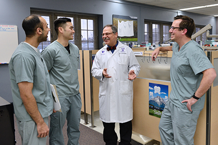 Photo of Dr. Mamandras and a group of trainees