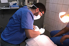 Photograph of Mohamad Sharkh working in a clinic