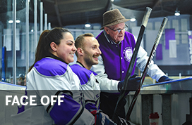 Photograph of two Might Dents sitting on the bench talking to their coach