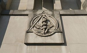 Photograph of the dentistry crest at the entrance of the dentistry building on campus